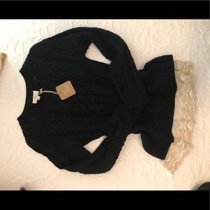 Black sweater with cream lace trim around bottom
